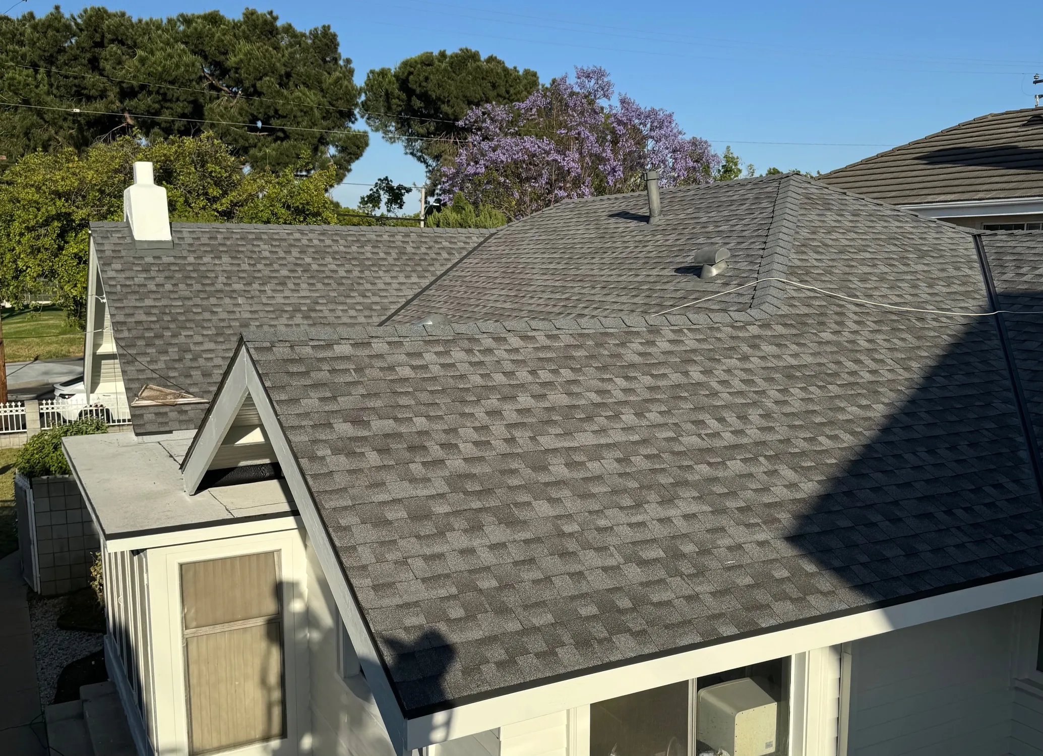 Completed architectural shingle roof replacement on a single-family home in Monterey Park, California, elevated view